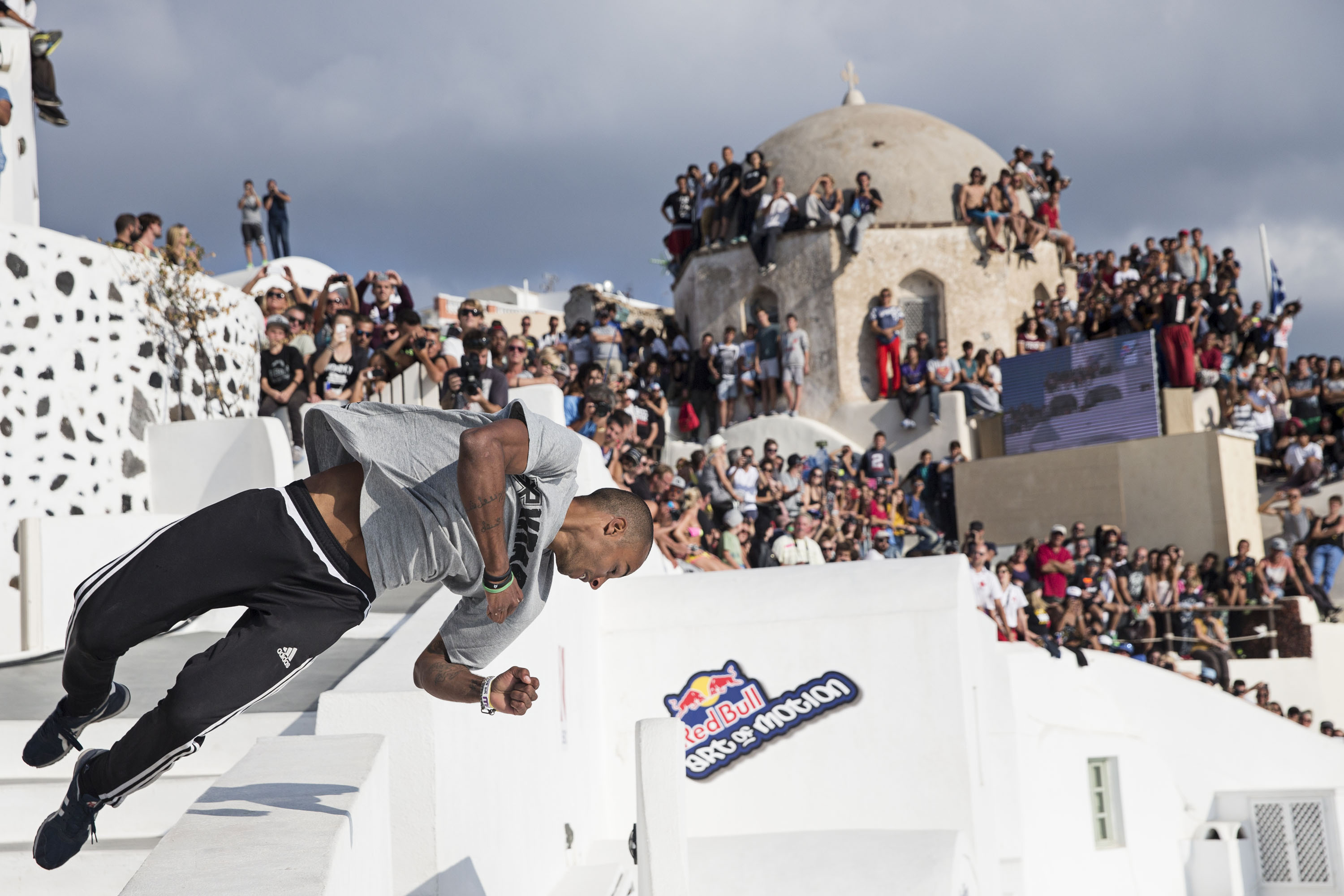 Achraf Dibani of Marocco performs during the finals at the "Red Bull Art of Motion" freerunning competition on Santorini Island, Greece on October 3, 2015